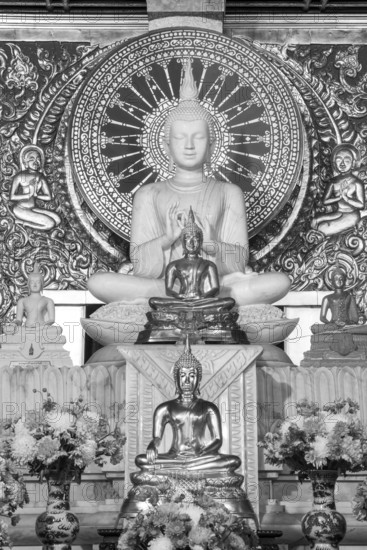 Various Buddha statues, Bhumispara mudra, Buddha Gautama at the moment of enlightenment, as well as meditating and teaching, Wat Sitthawararam, Bangkok, Thailand