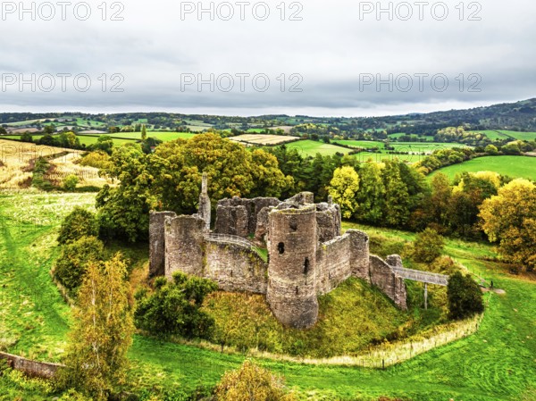 Autumn Colours over ruins of Grosmont Castle from a drone, Grosmont, Monmouthshire, Wales, UK