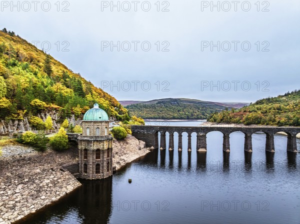 Autumn over Garreg Ddu Dam from a drone, Elan Valley, Caban-Coch Reservoir, Rhayader, Wales, UK