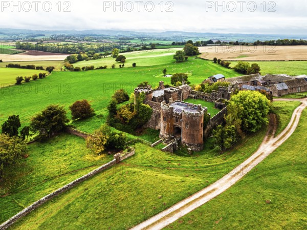 Autumn Colours over ruins of Pembridge Castle or Newland Castle from a drone, Herefordshire, England, United Kingdom