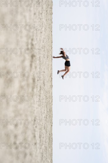 Symbolic picture, abstract, woman falling, rotated image on the Etosha pan, salt pan, Etosha National Park, Namibia