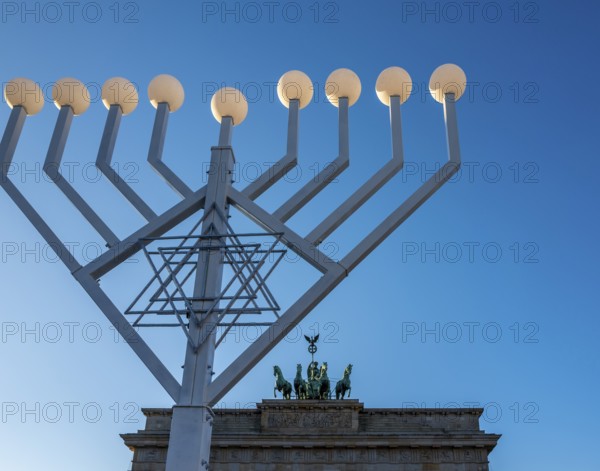 Large Hanukkah chandelier at the Brandenburg Gate in daylight, sign of lively Jewish life, symbolic power for 20 years, Berlin, Germany