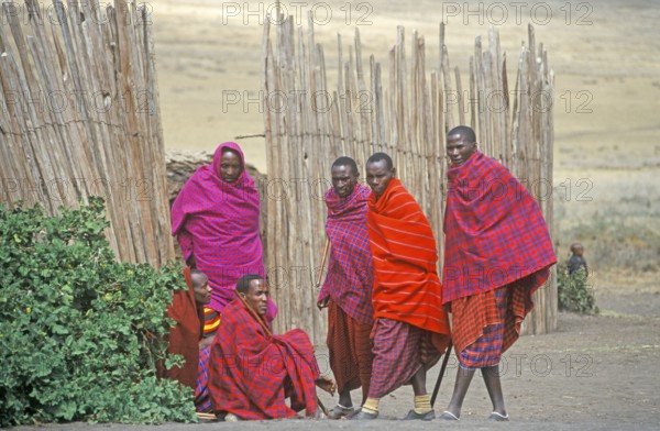 Maasai men in front of their village in Ngorongoro Crater, Tanzania, Africa, June 2000, vintage, retro, old, historic