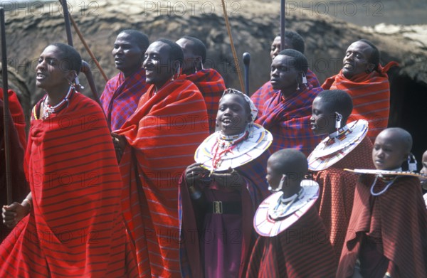 Maasai men and girls in their village in the Ngorongoro Crater dancing for tourists, Tanzania, Africa, June 2000, vintage, retro, old, historic