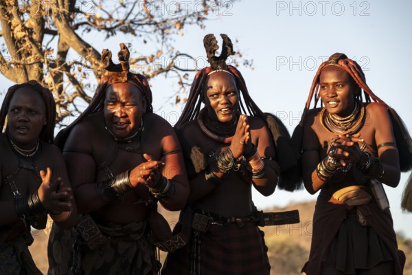 Himba woman dancing euphorically, traditional dance, traditional Himba village, Kaokoveld, Kunene, Namibia