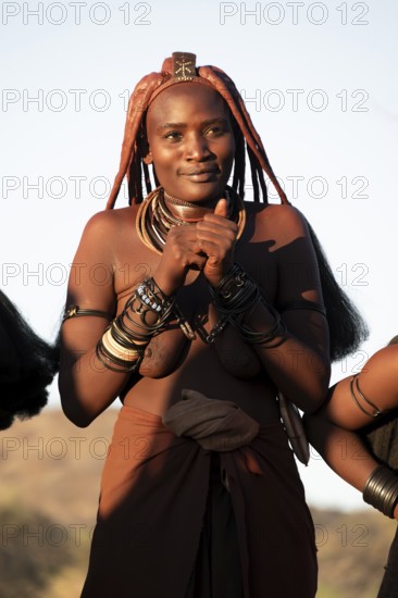 Himba woman dancing euphorically, traditional dance, traditional Himba village, Kaokoveld, Kunene, Namibia