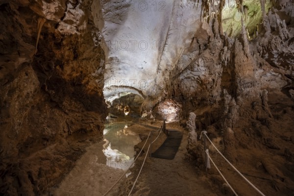 Stalactites and stalagmites, reflection in a small underground lake, rock formations in a stalactite cave, Grotta del Fico, Gulf of Orosei, Baunei, Sardinia, Italy
