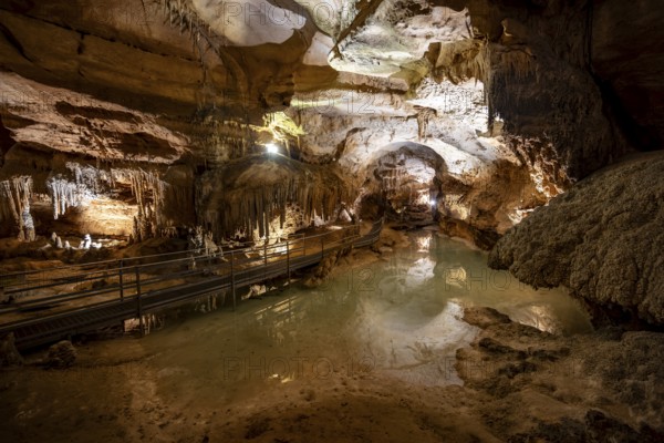 Stalactites and stalagmites, small underground lake and rock formations in a stalactite cave, Grotta del Fico, Gulf of Orosei, Baunei, Sardinia, Italy