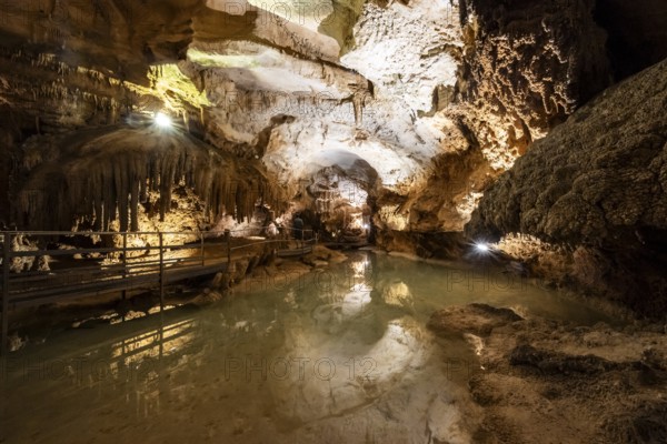 Stalactites and stalagmites, small underground lake, rock formations in a stalactite cave, Grotta del Fico, Gulf of Orosei, Baunei, Sardinia, Italy