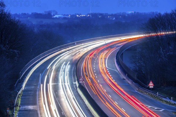 Evening traffic on the A52 motorway, between Düsseldorf and Essen, at the Ruhr Valley Bridge, across the Ruhr near Mülheim-Mintard, partly slow, rush hour traffic, looking north, North Rhine-Westphalia, Germany