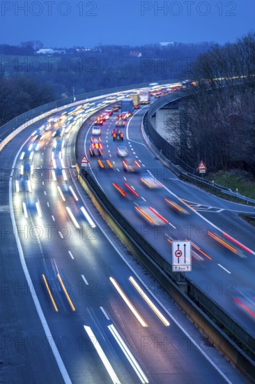 Evening traffic on the A52 motorway, between Düsseldorf and Essen, at the Ruhr Valley Bridge, across the Ruhr near Mülheim-Mintard, partly slow, rush hour traffic, looking north, North Rhine-Westphalia, Germany