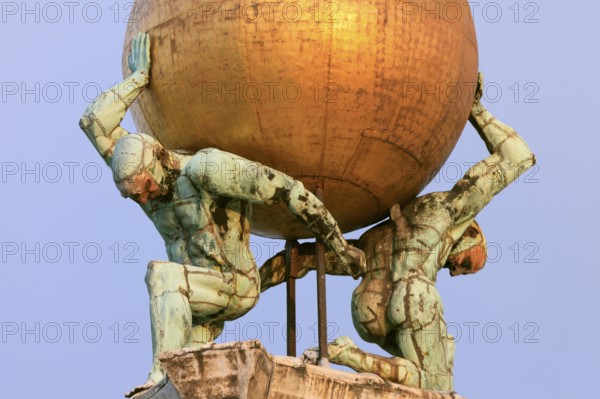 Two atlases carry a gilded globe with Fortuna carrying a moving wind vane, Venice, Veneto, Italy