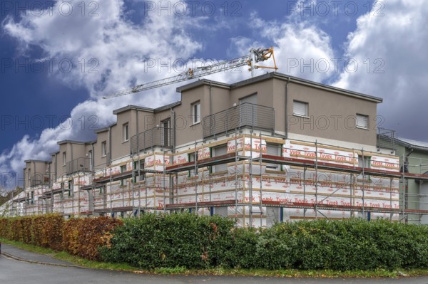Installation of thermal insulation on a residential block, Eckental, Middle Franconia, Bavaria, Germany