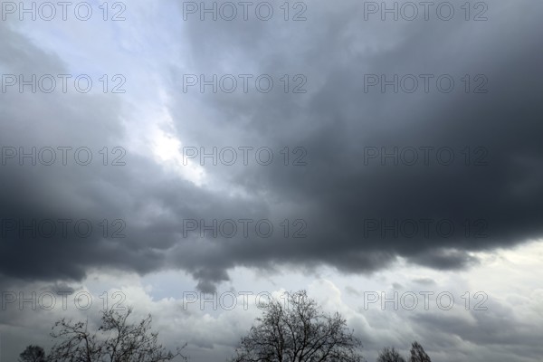 Large grey cloud roller Stratocumulus cluster layer cloud during high winter conditions, international