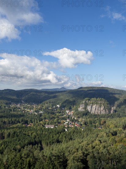 Mountain landscape with forest, rocks and village, view of Oybin, Zittau Mountains, Saxony, Germany