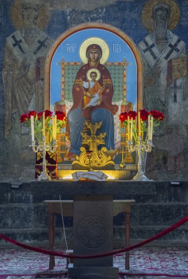 Icon of the Mother of God and Child Jesus surrounded by candles and flowers on an altar, Akhtala monastery, Akhtala town, Lorikeet province, Armenia