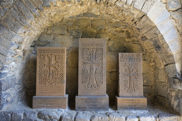 Three khachkars with detailed stone carving in a stone niche, cross stones, Akhtala monastery, Akhtala, town of Akhtala, province of Lorikeet, Armenia