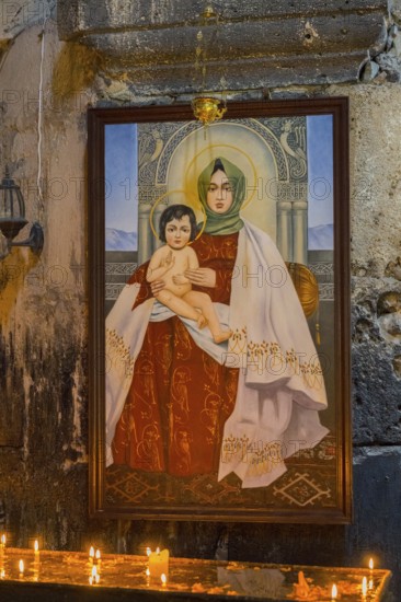 Madonna icon with child in a candle-illuminating church room, Akhtala monastery, Akhtala town, Lorikeet province, Armenia