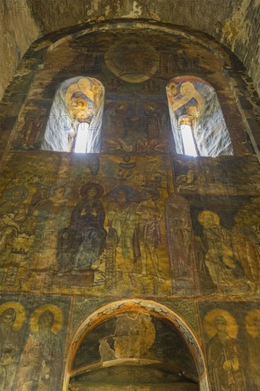 Old wall paintings in a church depicting saints and religious symbols, Akhtala monastery, Akhtala town, Lorikeet province, Armenia