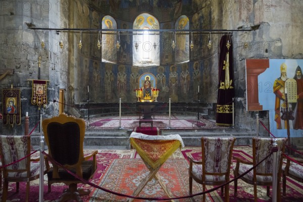 Church room with altar and religious icons decorated with carpets and candles, Akhtala monastery, Akhtala town, Lorikeet province, Armenia