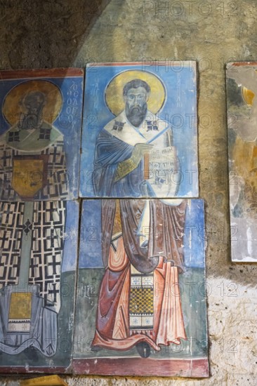 Icon painting on an old stone church wall depicting holy figures, Akhtala monastery, Akhtala, town of Akhtala, Lorikeet province, Armenia