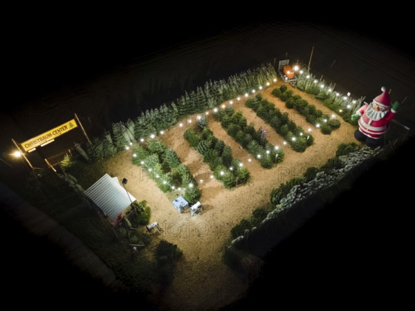 In a Christmas tree centre near Frankfurt am Main there is a decorative inflatable figure of Father Christmas several metres high. (Aerial photo taken with a drone), Frankfurt am Main, Hesse, Germany