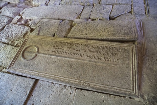 Stone slab with engraved text, part of a historical archaeological find, Sanahin monastery, Sanahin town, UNESCO World Heritage Site, Lorikeet province, Armenia