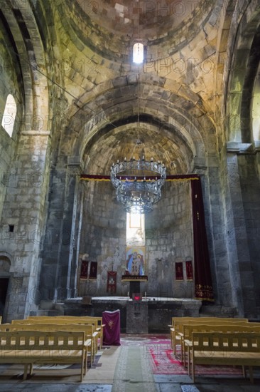 Spacious church room with altar, high ceiling and magnificent chandelier, Sanahin monastery, Sanahin village, UNESCO World Heritage Site, Lorikeet province, Armenia