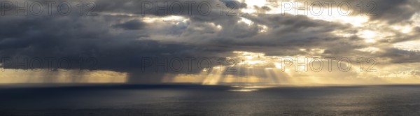 Sunset, sun rays over sea, dark rain cloud, rain, Madeira, Portugal