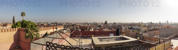 Extensive city view with low-rise buildings and blue sky, Morocco, Marrakech, panorama
