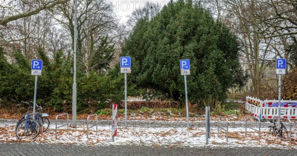Schilderwald, variety of road signs pointing to parking spaces for cyclists over a length of 20 meters, Berlin, Germany