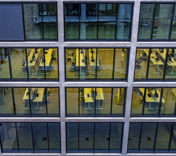 Desks with computers, workstations in an office complex on the former Tacheless, Berlin, Germany
