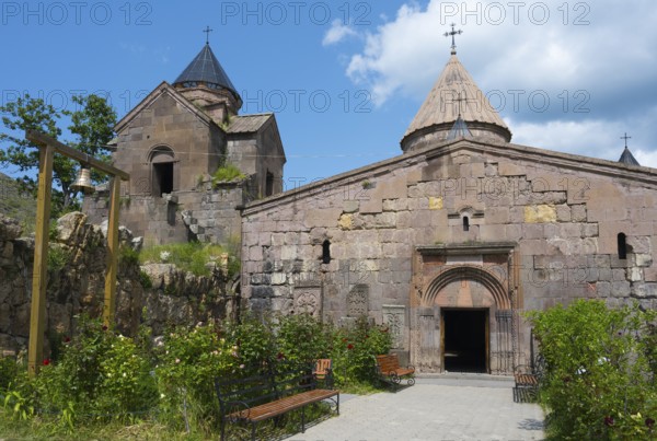 Historic monastery with towers and stone walls, surrounded by garden, Goshavank monastery, Tavush province, Armenia