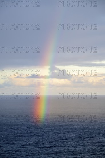 Rainbow over sea, dark rain cloud, rain, Madeira, Portugal