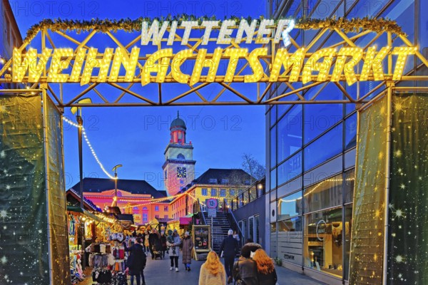 The entrance to the Witten Christmas market with the illuminated town hall, Ruhr area, North Rhine-Westphalia, Germany