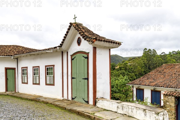 Old houses and chapel on the streets of the historic city of Ouro Preto, Ouro Preto, Minas Gerais, Brazil