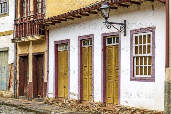 Facades of old houses worn by time in the city of Ouro Preto, Ouro Preto, Minas Gerais, Brazil