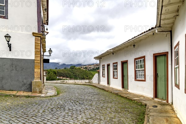 A winding street between historic houses in the city of Ouro Preto, Ouro Preto, Minas Gerais, Brazil