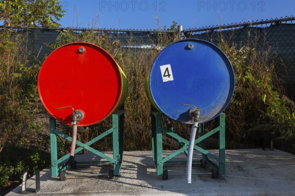 Gas and diesel fuel tanks for filling up lawn mowers, edge trimmers, chainsaws and small tractors etc for public garden maintenance, Quebec, Canada