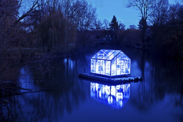 The river Lippe with the artwork Arche by Christoph Hildebrand at night, Lichtpromenade Lippstadt, North Rhine-Westphalia, Germany