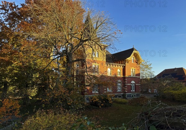Villa-like house with garden in autumn, Lippstadt, North Rhine-Westphalia, Germany