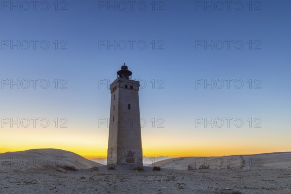 Rubjerg Knude Fyr / Rubjerg Knude lighthouse in the sand dunes on the top of Lønstrup Klint at dawn, Hjørring, North Jutland, Denmark