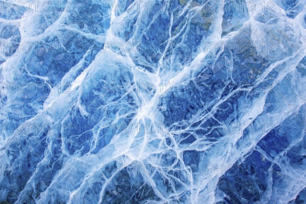 Close-up of blue ice, made of compressed snow, structure showing cracks and fissures inside glacier, Spitsbergen / Svalbard, Norway