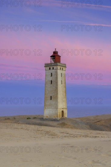 Rubjerg Knude Fyr / Rubjerg Knude lighthouse in the sand dunes on the top of Lønstrup Klint at dawn, Hjørring, North Jutland, Denmark