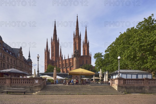 Evangelische Marktkirchengemeinde Wiesbaden, Marktkirche church, neo-Gothic style, architect Carl Boos, outdoor area of a restaurant, Lumen restaurant, sandstone wall, staircase, paving stone square, town hall, lantern, trees, blue sky, cumulus clouds, cirrostratus clouds, diffuse light, sunny, market square, Wiesbaden, state capital, district-free city, Hesse, Germany