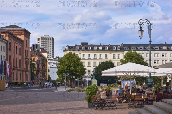 Lantern, general architecture, high-rise building, outdoor area of a restaurant, trees, visitors and pedestrians as secondary motifs, blue sky, cumulus clouds, evening light, Schlossplatz square, An den Quellen, Wiesbaden, state capital, district-free city, Hesse, Germany
