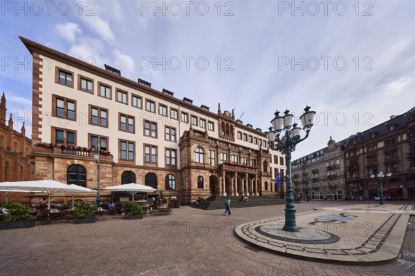 Town Hall, Neo-Renaissance style, architect Georg von Hauberrisser, façade with windows, staircase, paving stone square, mosaic, pattern, lantern, outdoor area of a restaurant, general architecture, pedestrians as accessories, seated people, blue sky, cumulus clouds, Schlossplatz square, Wiesbaden, state capital, district-free city, Hesse, Germany