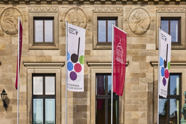 Rheingau Music Festival, spa hotel Wiesbaden, advertising flags on flagpoles, spa hotel, sandstone building material, façade, sunny, Kurhausplatz, Wiesbaden, state capital, district-free city, Hesse, Germany