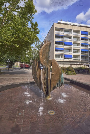 Fountain complex, bronze sculpture, sculptor Ernst Dostal, general architecture, residential and commercial buildings, trees, Kaiser-Friedrich-Platz, Wiesbaden, state capital, district-free city, Hesse, Germany