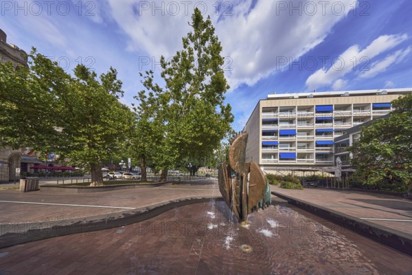 Fountain complex, bronze sculpture, sculptor Ernst Dostal, general architecture, residential and commercial buildings, trees, Kaiser-Friedrich-Platz, Wiesbaden, state capital, district-free city, Hesse, Germany